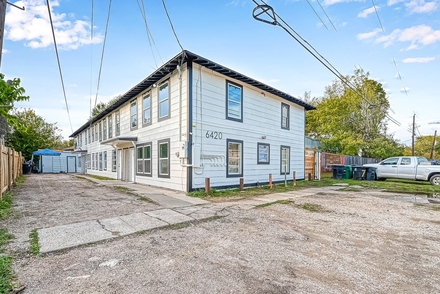 6420 Conley Street, Unit 4 Houston, TX 77021 - Photo 6 of 27 a view of a house with a big yard and large trees