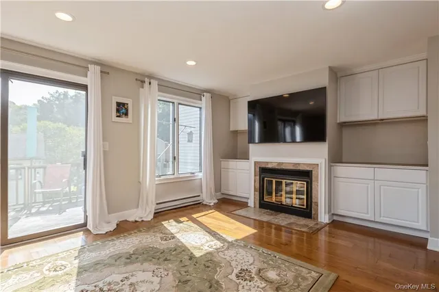 a view of living room with furniture and a fireplace