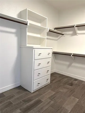 a view of an empty walk in closet