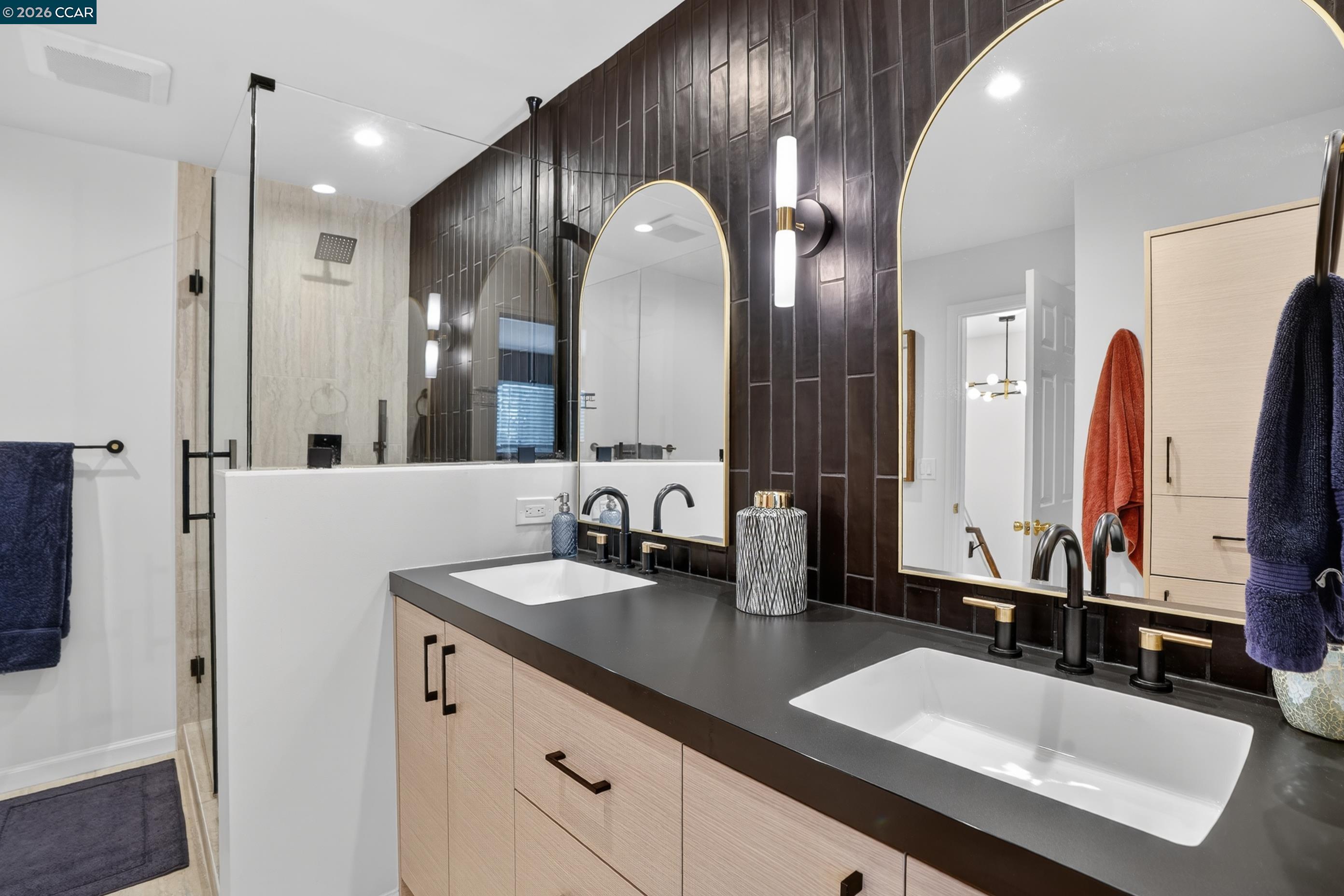 1812 Wildbrook Court, Unit C Concord, CA 94521 - Photo 13 of 35 a bathroom with double vanity sinks and a large mirror