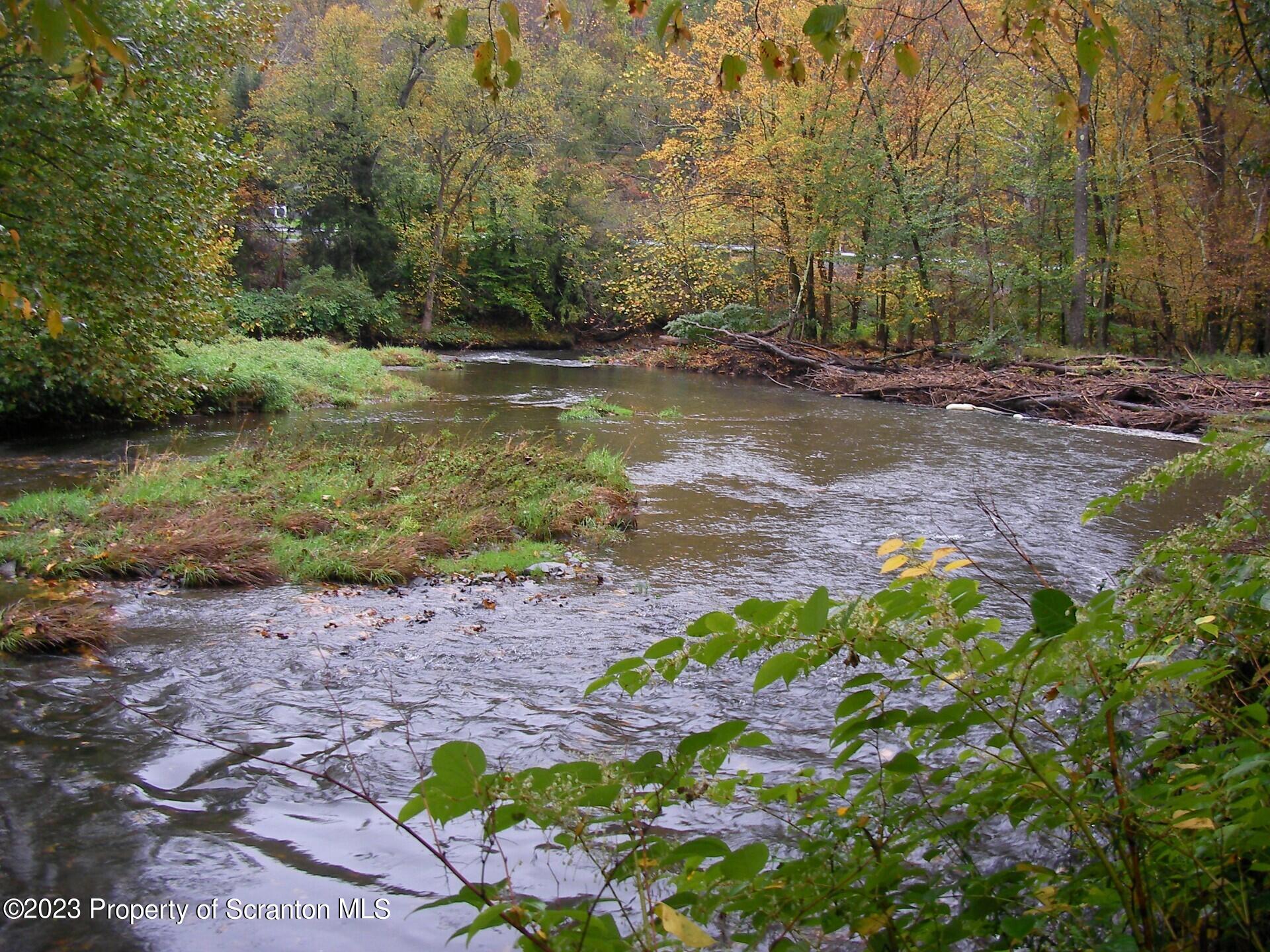 916 Creek Road Nicholson, PA 18446 - Photo 7 of 10 a backyard of a house with lots of green space