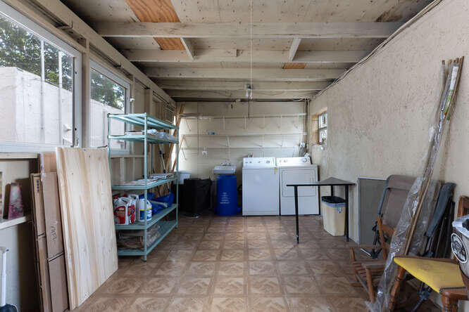 830 Valley Forge Road West Palm Beach, FL 33405 - Photo 17 of 23 laundry and storage area