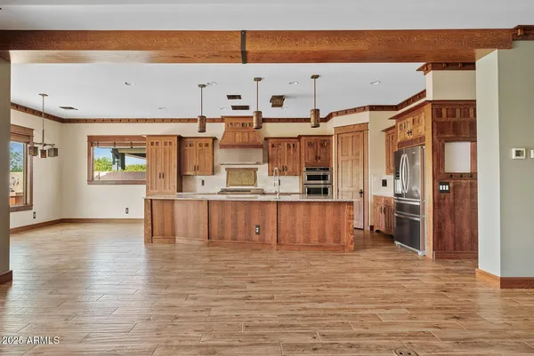 a view of kitchen with furniture and wooden floor
