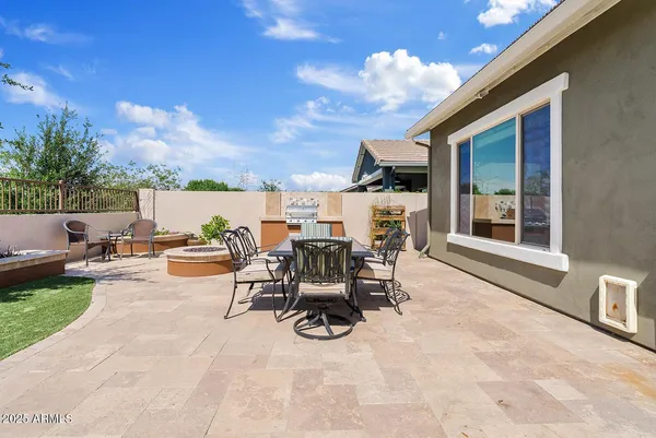 a outdoor dining space with furniture and a potted plant