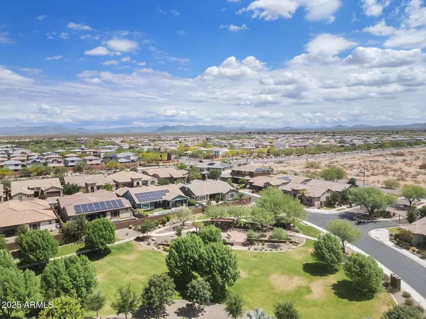 an aerial view of residential houses with outdoor space
