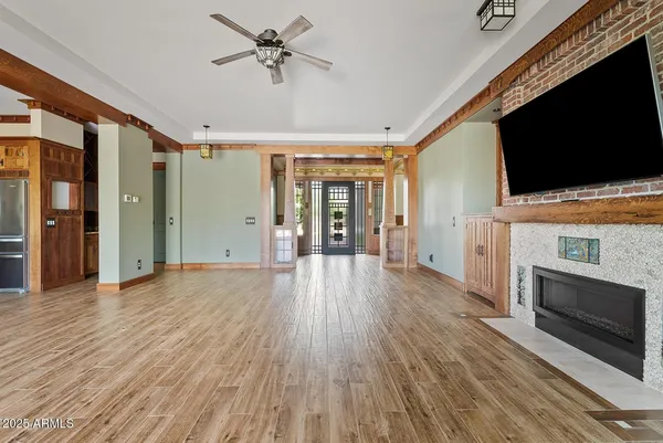 a view of a livingroom with an empty space and a fireplace