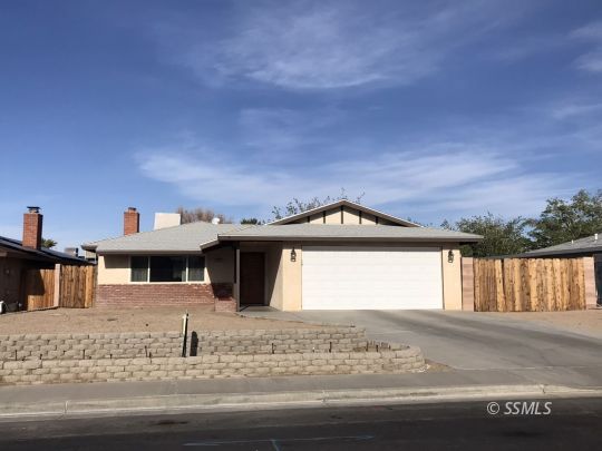 1272 North Inyo Street Ridgecrest, CA 93555 - Photo 1 of 24 a front view of a house with a yard