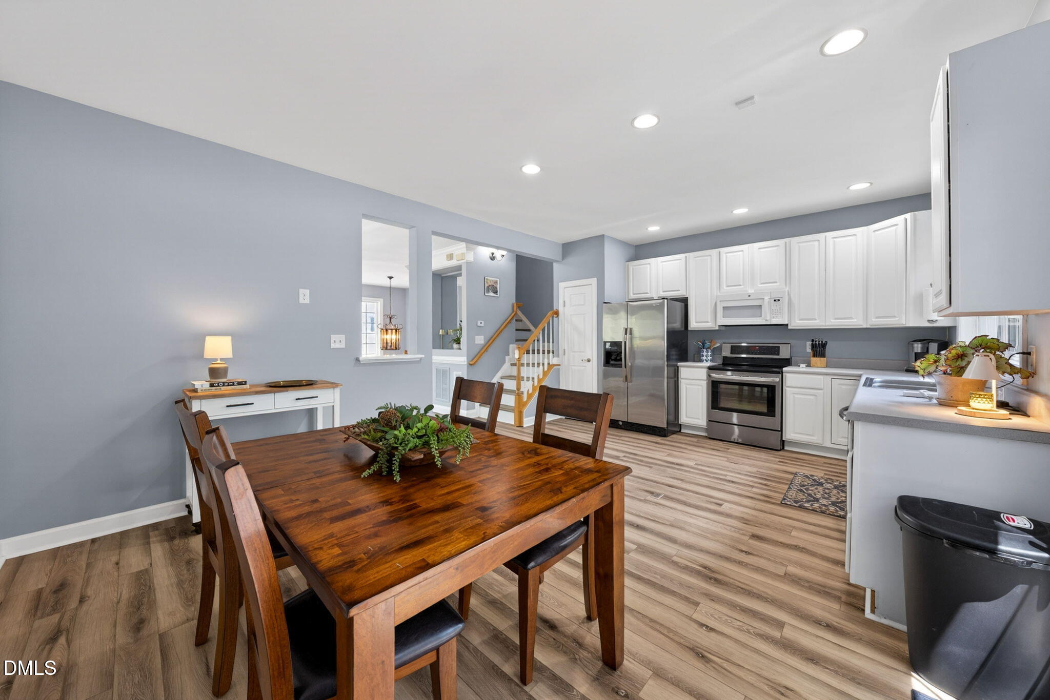 5500 Vista View Court Raleigh, NC 27612 - Photo 20 of 38 a view of a dining room with furniture and wooden floor