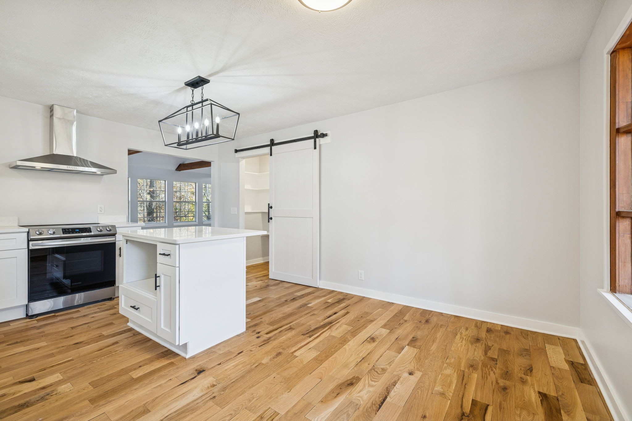 4222 Gourley Road Pegram, TN 37143 - Photo 22 of 76 a kitchen with stainless steel appliances granite countertop a stove and a refrigerator