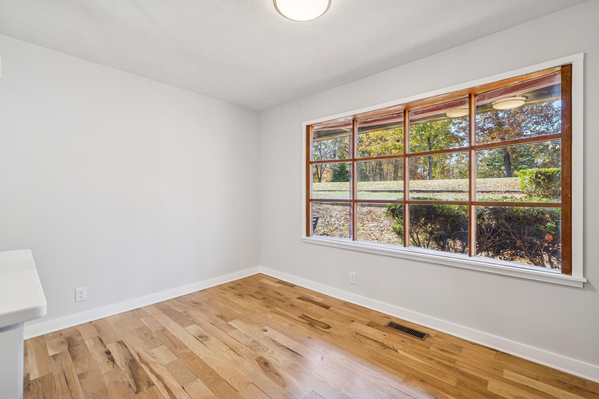 4222 Gourley Road Pegram, TN 37143 - Photo 27 of 76 a view of empty room with wooden floor and fan