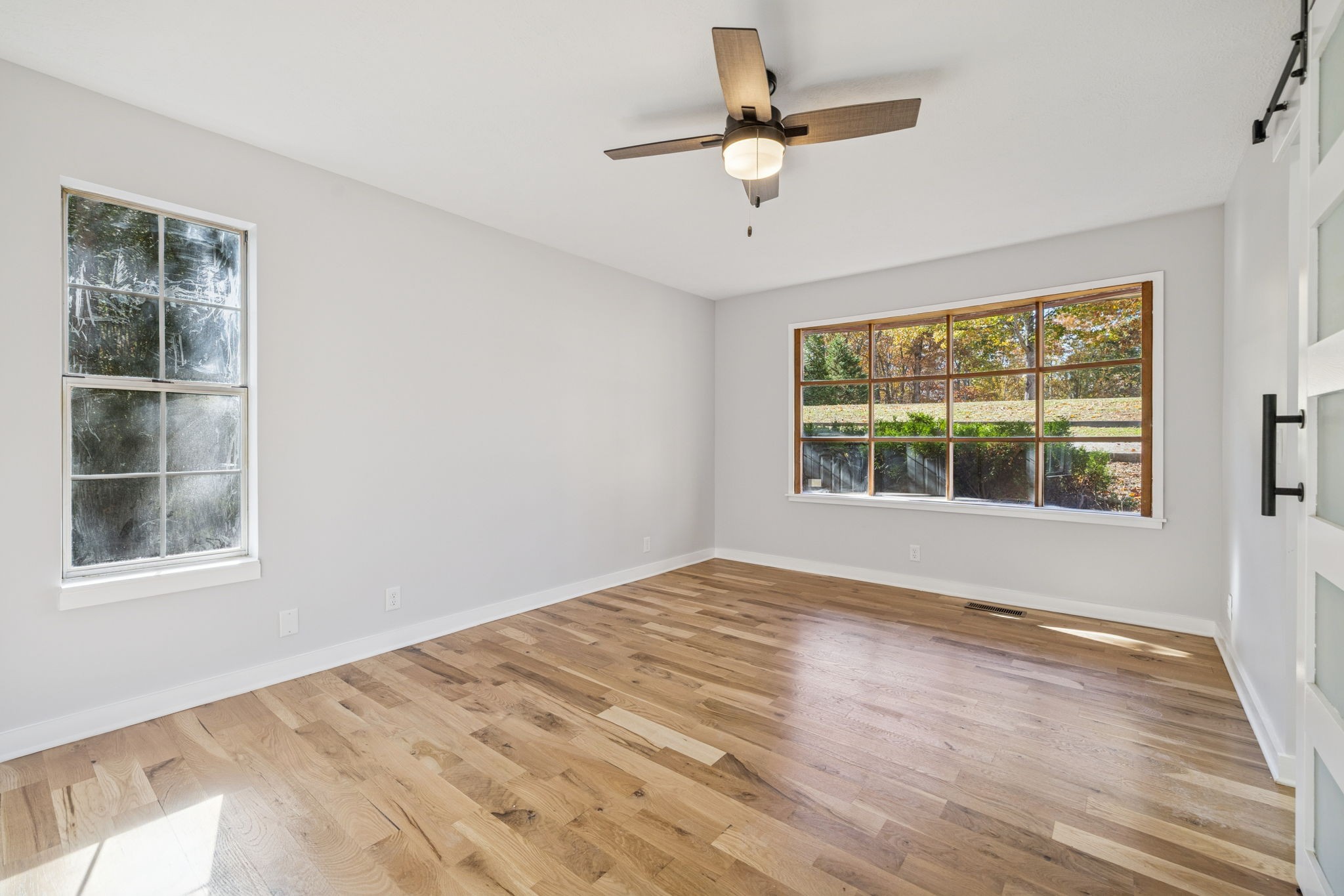 4222 Gourley Road Pegram, TN 37143 - Photo 28 of 76 a view of an empty room with wooden floor and a window
