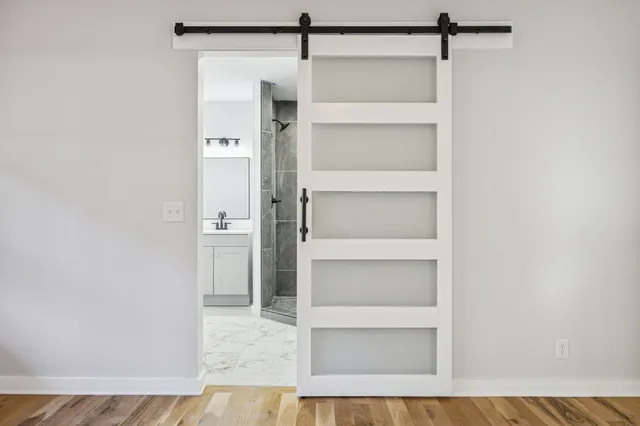 a view of staircase with railing and a window
