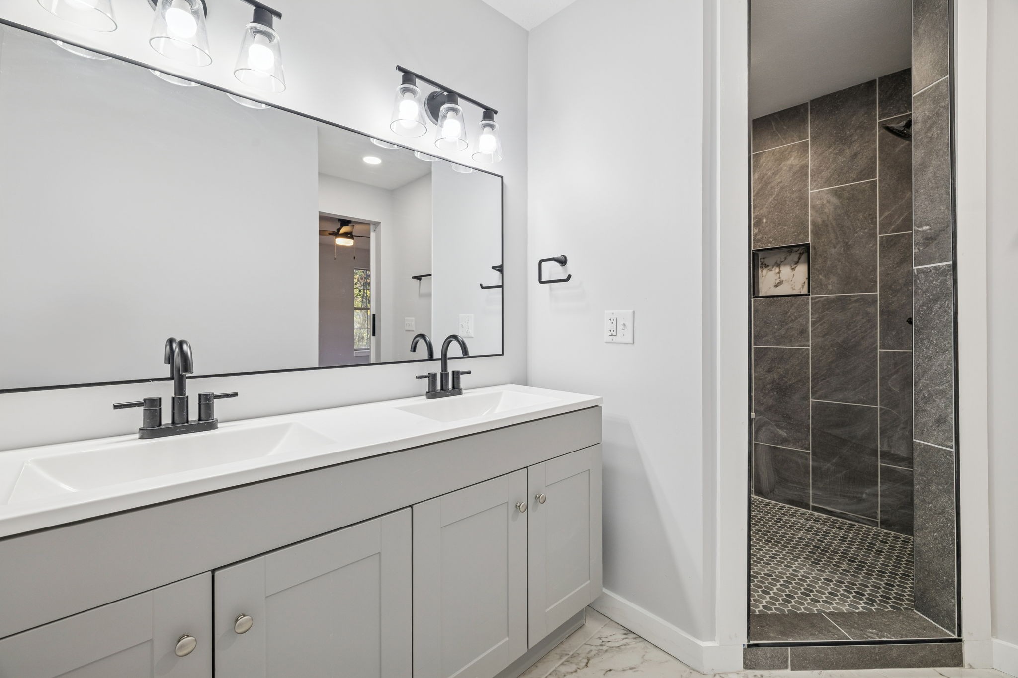 4222 Gourley Road Pegram, TN 37143 - Photo 35 of 76 a bathroom with a double vanity sink and mirror