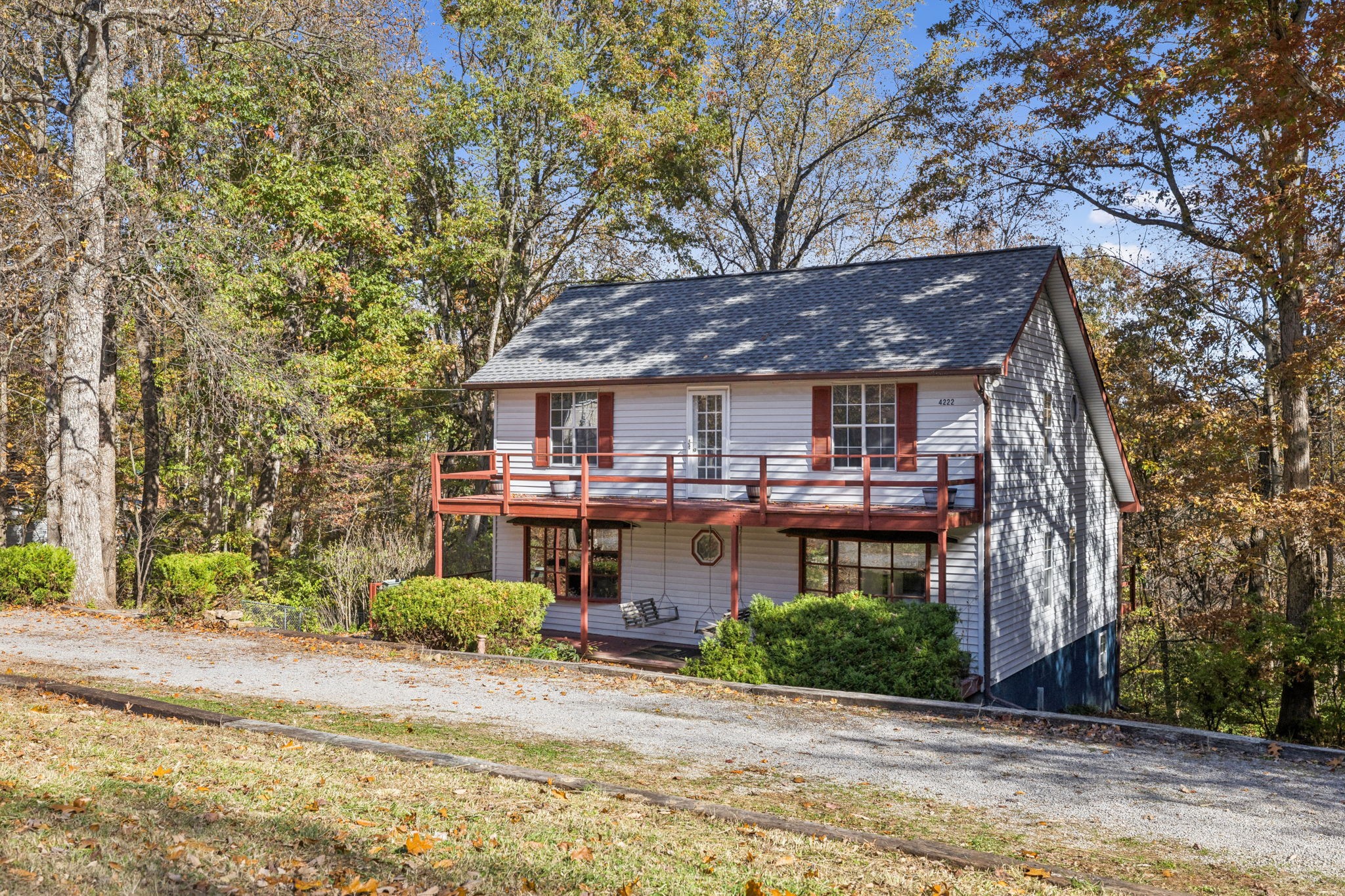 4222 Gourley Road Pegram, TN 37143 - Photo 4 of 76 a front view of a building with a garden and tree