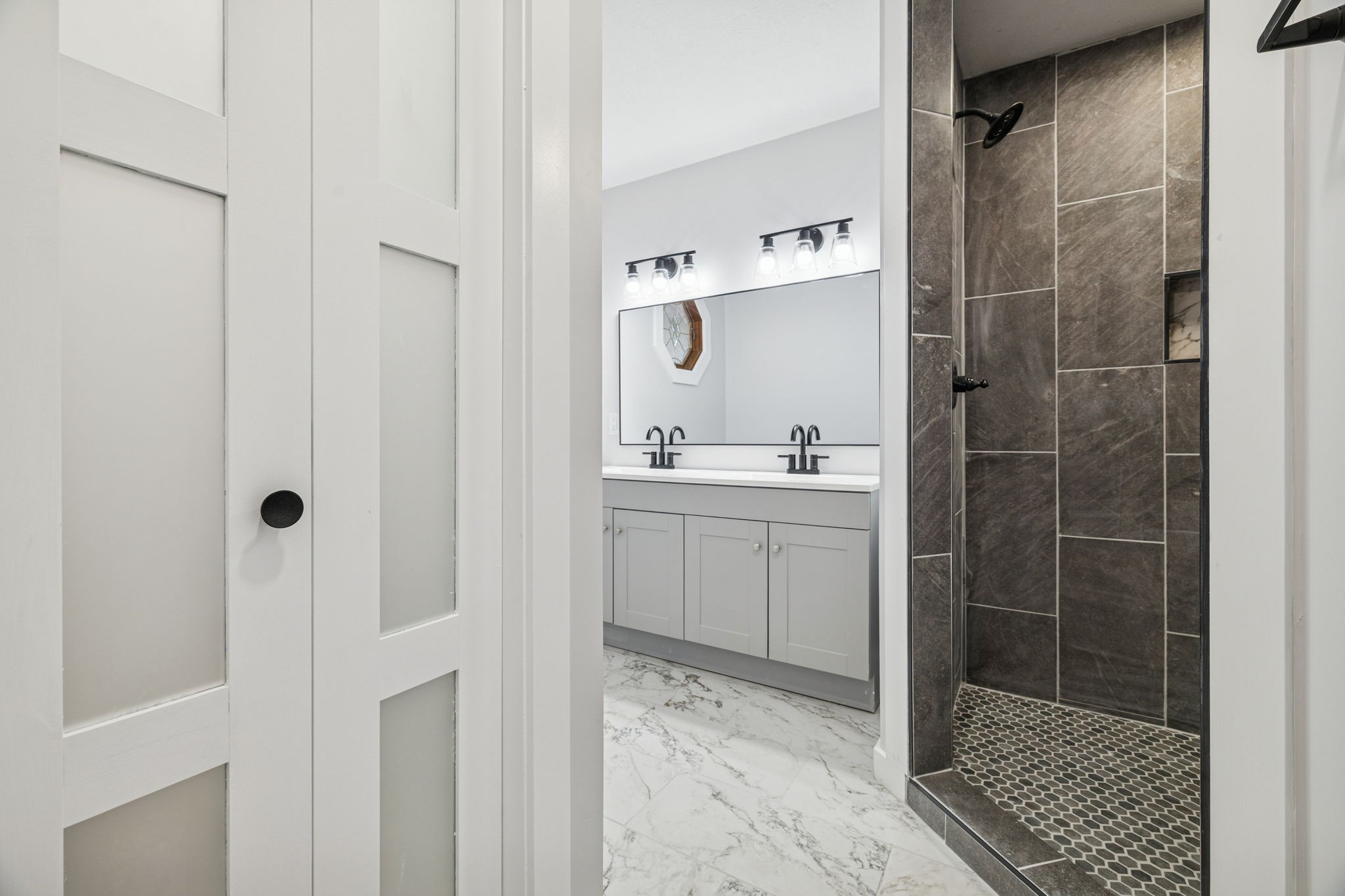 4222 Gourley Road Pegram, TN 37143 - Photo 41 of 76 a bathroom with a shower sink and mirror