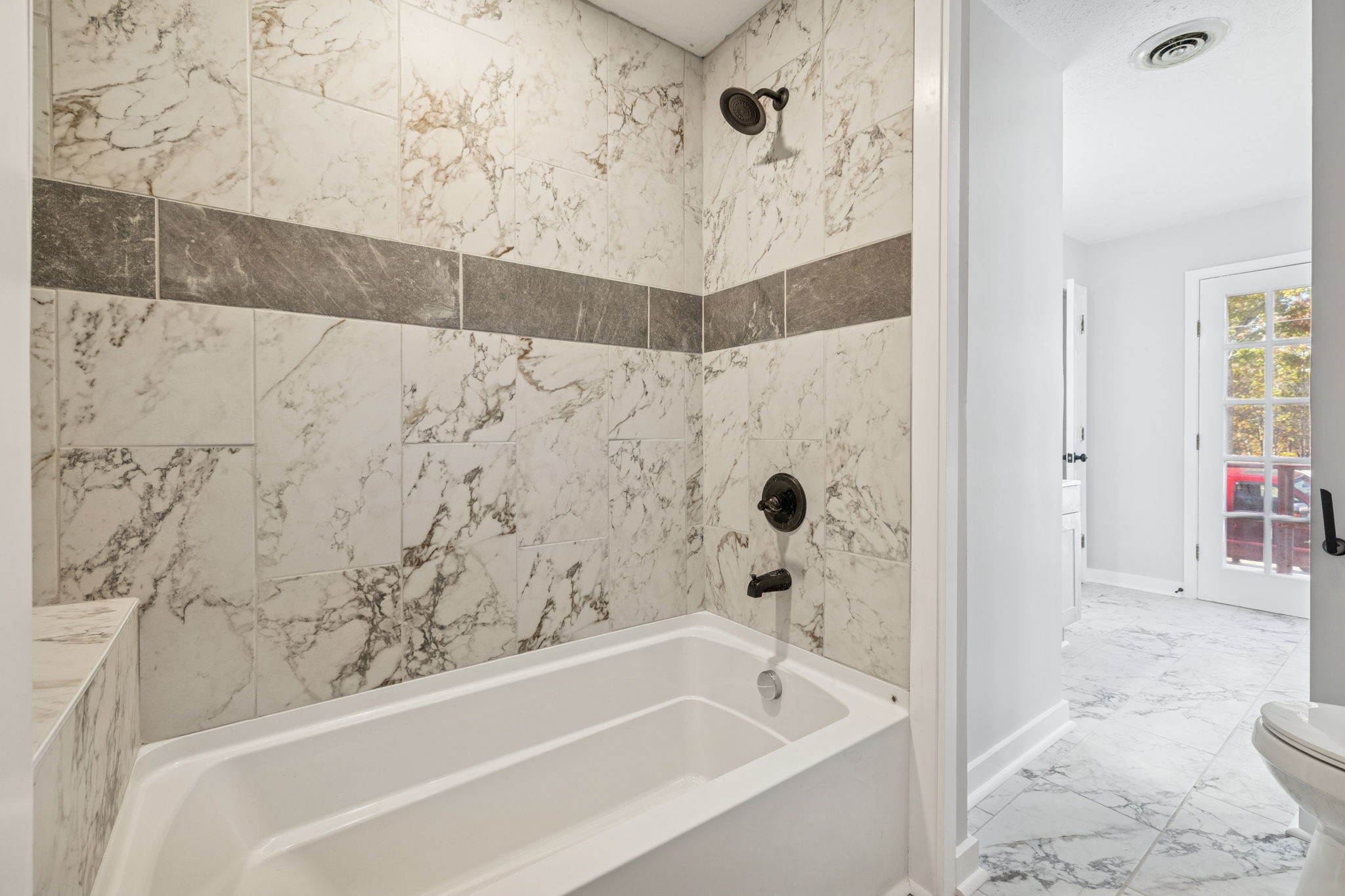 4222 Gourley Road Pegram, TN 37143 - Photo 61 of 76 a bathroom with a bathtub and shower