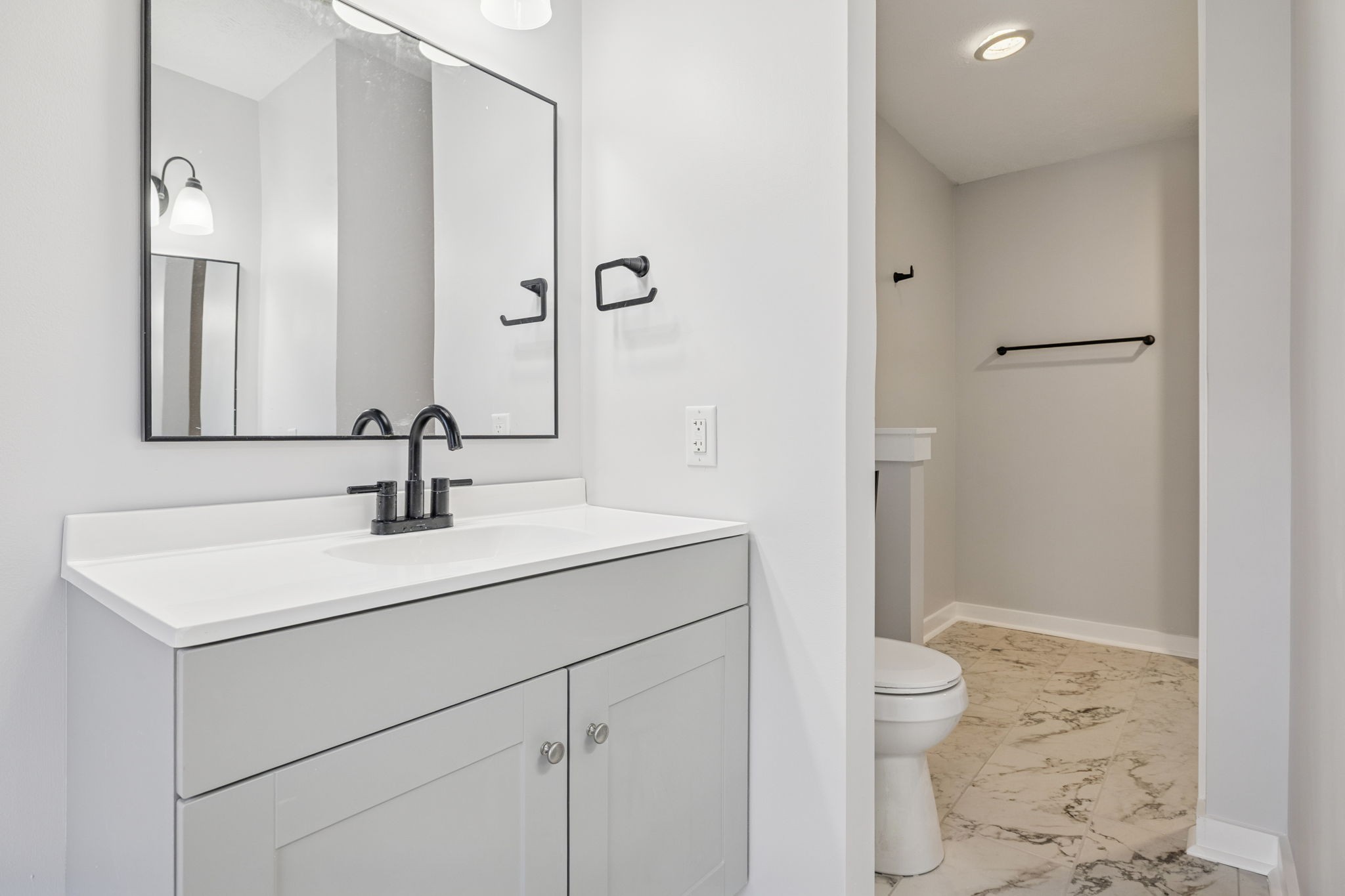 4222 Gourley Road Pegram, TN 37143 - Photo 63 of 76 a bathroom with a sink toilet vanity and shower