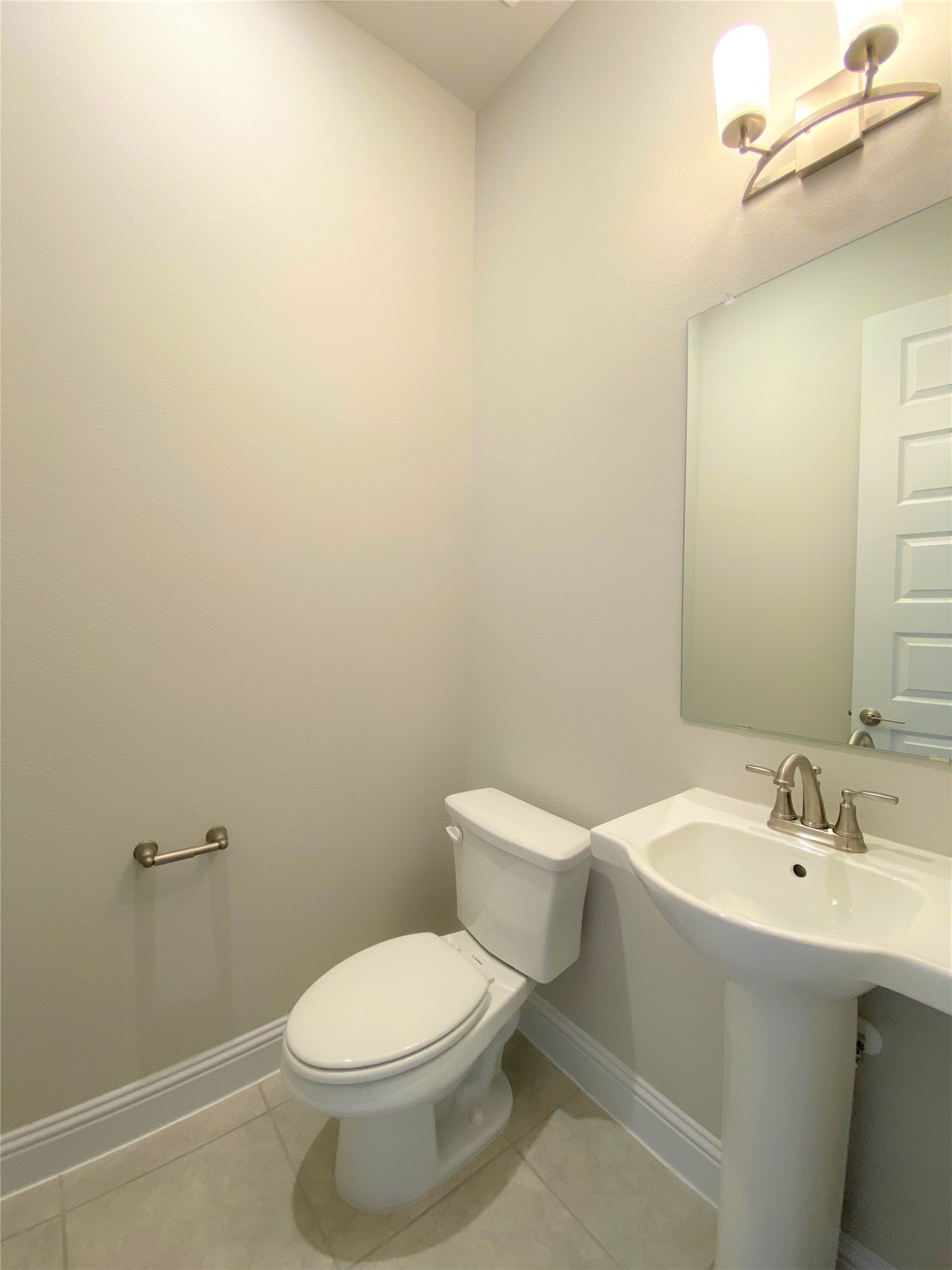 600 C-Bar Ranch Trail, Unit 105 Cedar Park, TX 78613 - Photo 4 of 12 Half bathroom with light tile patterned flooring and baseboards