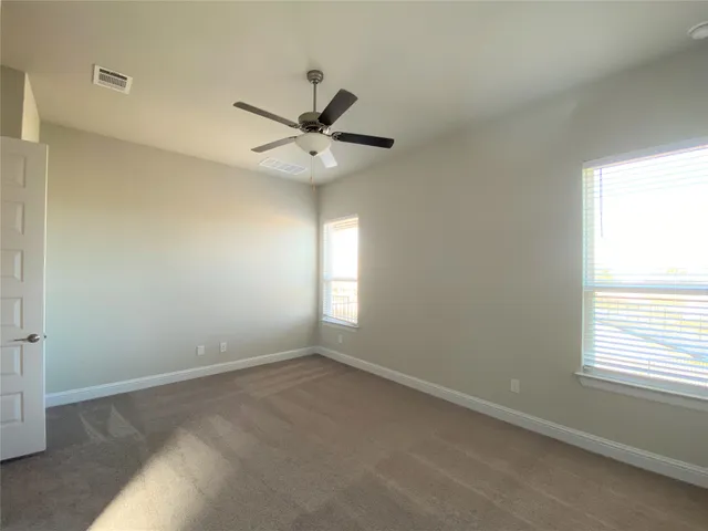 a bathroom with a double vanity sink and mirror
