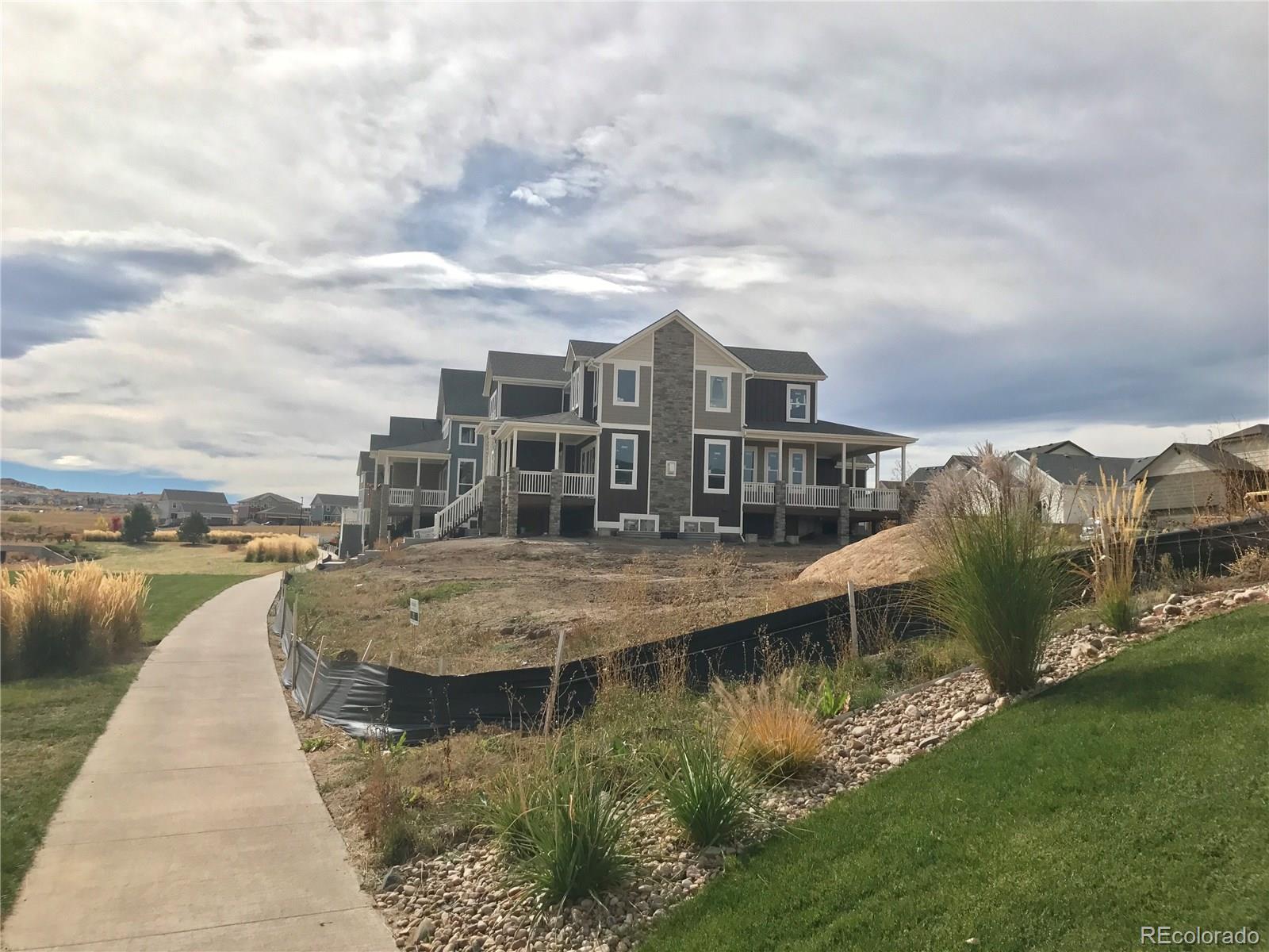 4378 Fell Mist Way Castle Rock, CO 80109 - Photo 5 of 18 a view of a lake with a city
