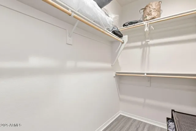 a view of workspace with wooden floor and windows