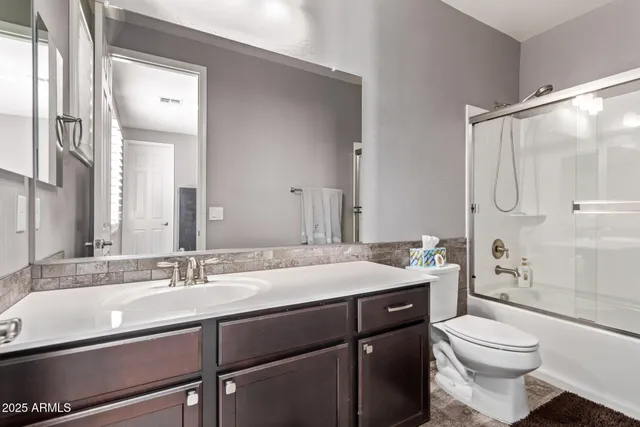 a close view of a sink and cabinets