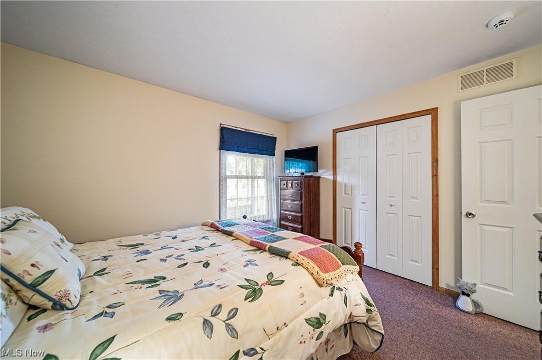 431 Ansel Road Geneva, OH 44041 - Photo 27 of 35 Bedroom with carpet flooring