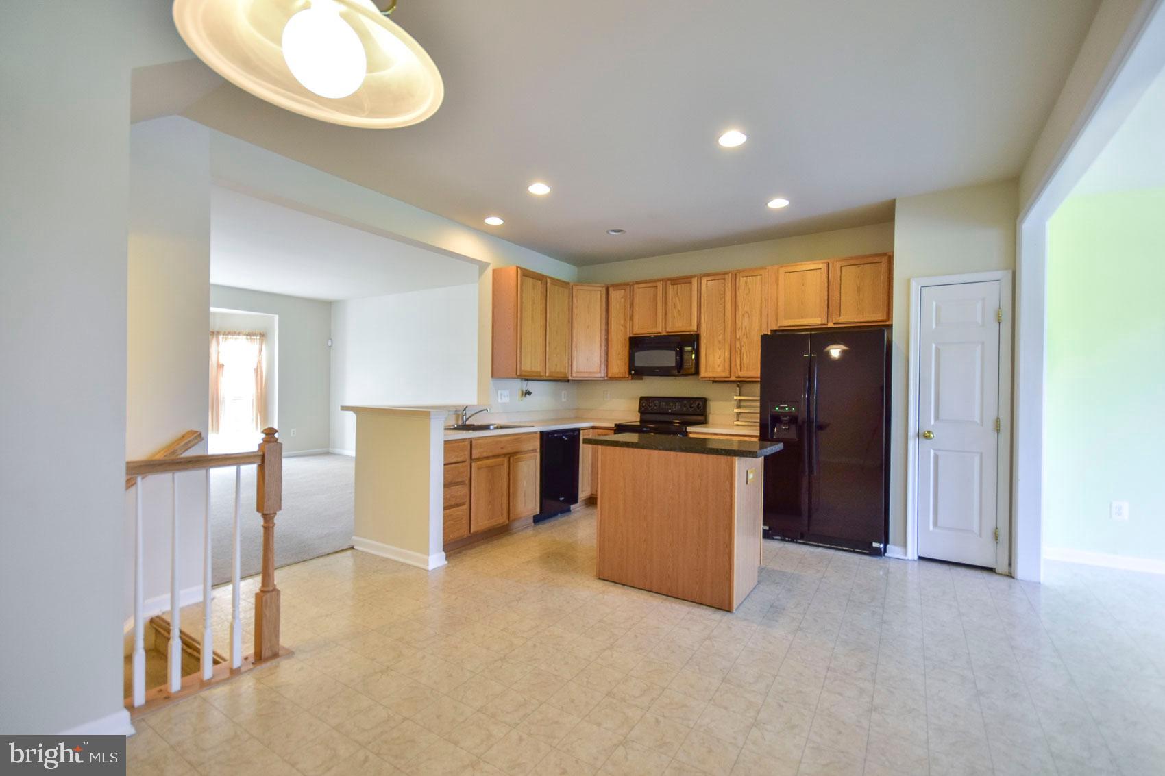 32 Lullwater Way Falling Waters, WV 25419 - Photo 35 of 37 Eat in kitchen and open floor plan