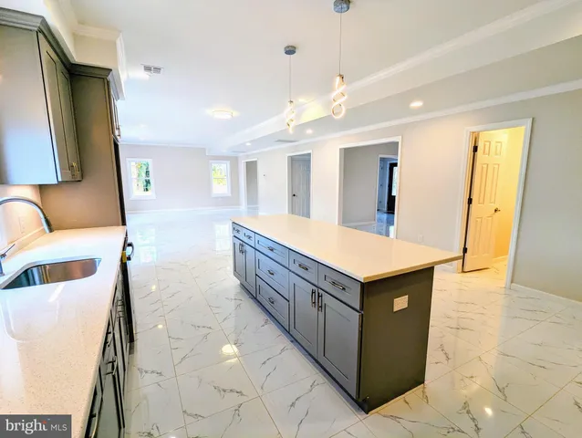 a bathroom with a sink vanity and mirror