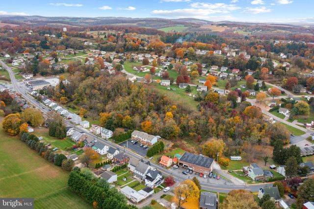 an aerial view of city and lake