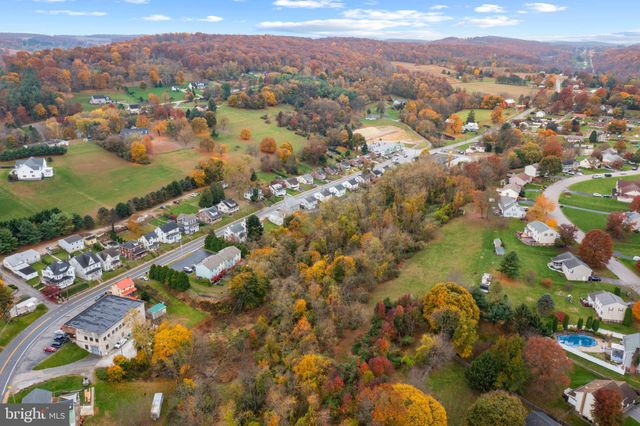 an aerial view of city and lake