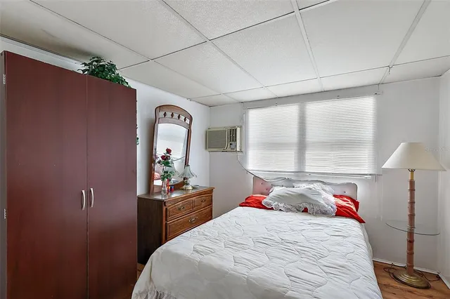 a bedroom with a bed and a lamp