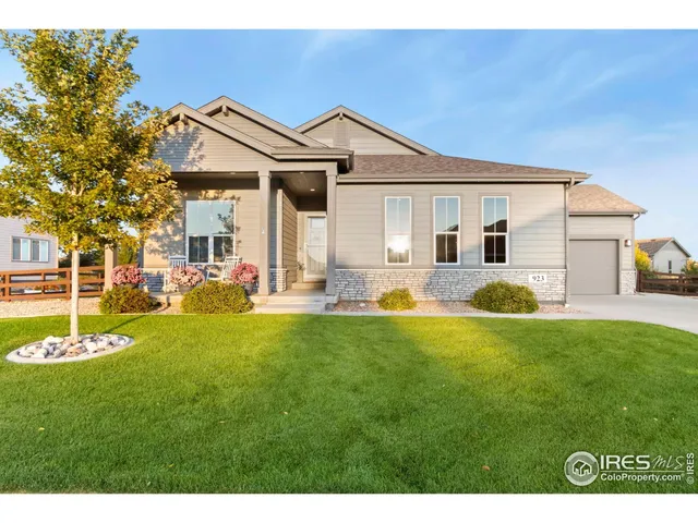 a front view of a house with a yard table and chairs