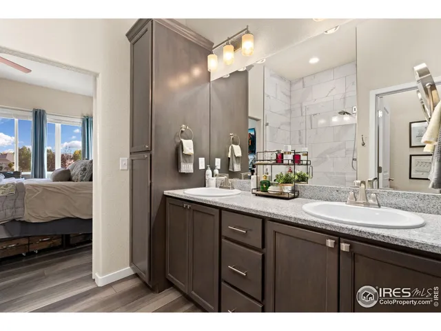 a bathroom with a sink double vanity and a mirror