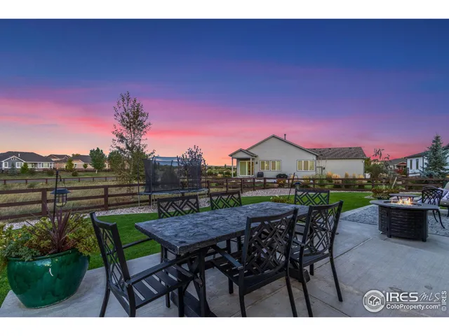 a view of a chairs and table in patio