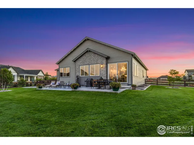 a view of a house with a yard porch and sitting area