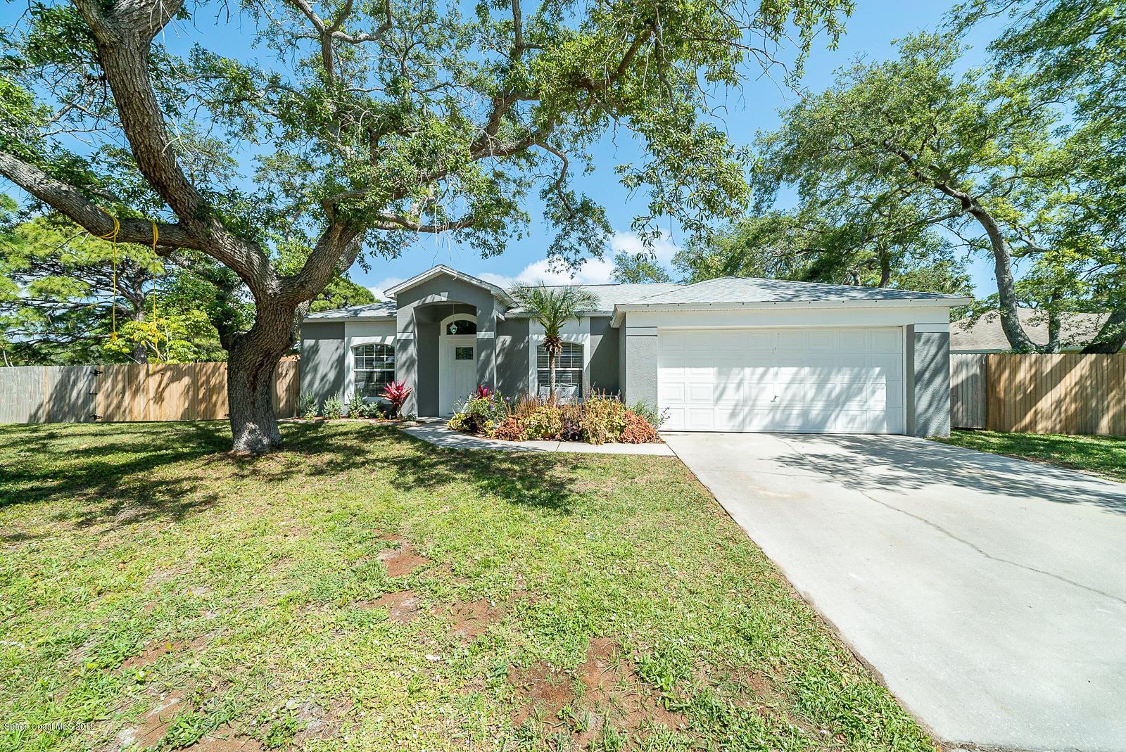 155 Bluff Terrace Melbourne, FL 32901 - Photo 2 of 20 a front view of a house with yard porch and tree