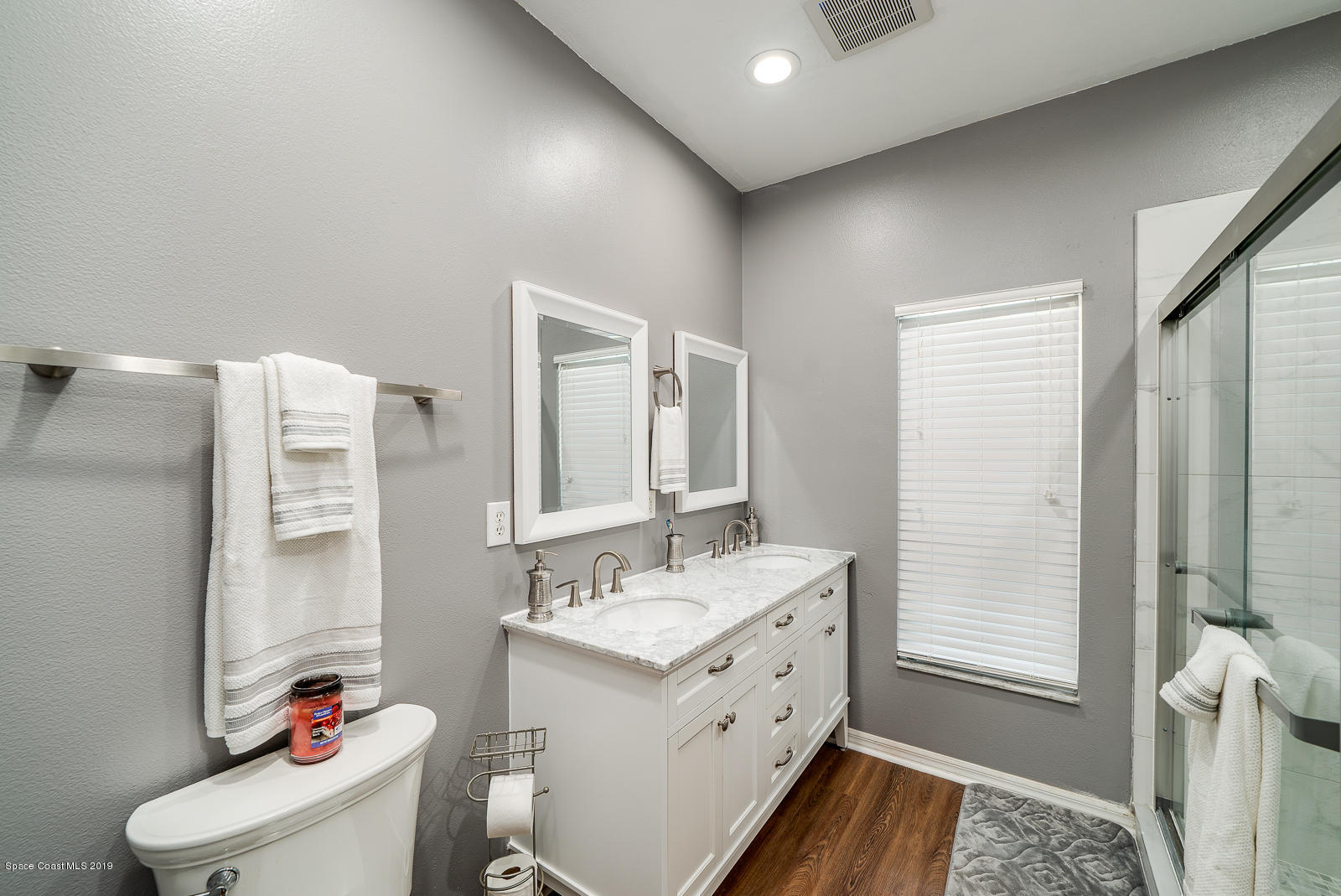155 Bluff Terrace Melbourne, FL 32901 - Photo 12 of 20 a bathroom with a sink mirror vanity and toilet