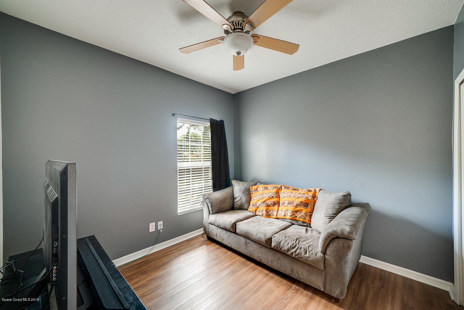 155 Bluff Terrace Melbourne, FL 32901 - Photo 14 of 20 a living room with furniture and a window