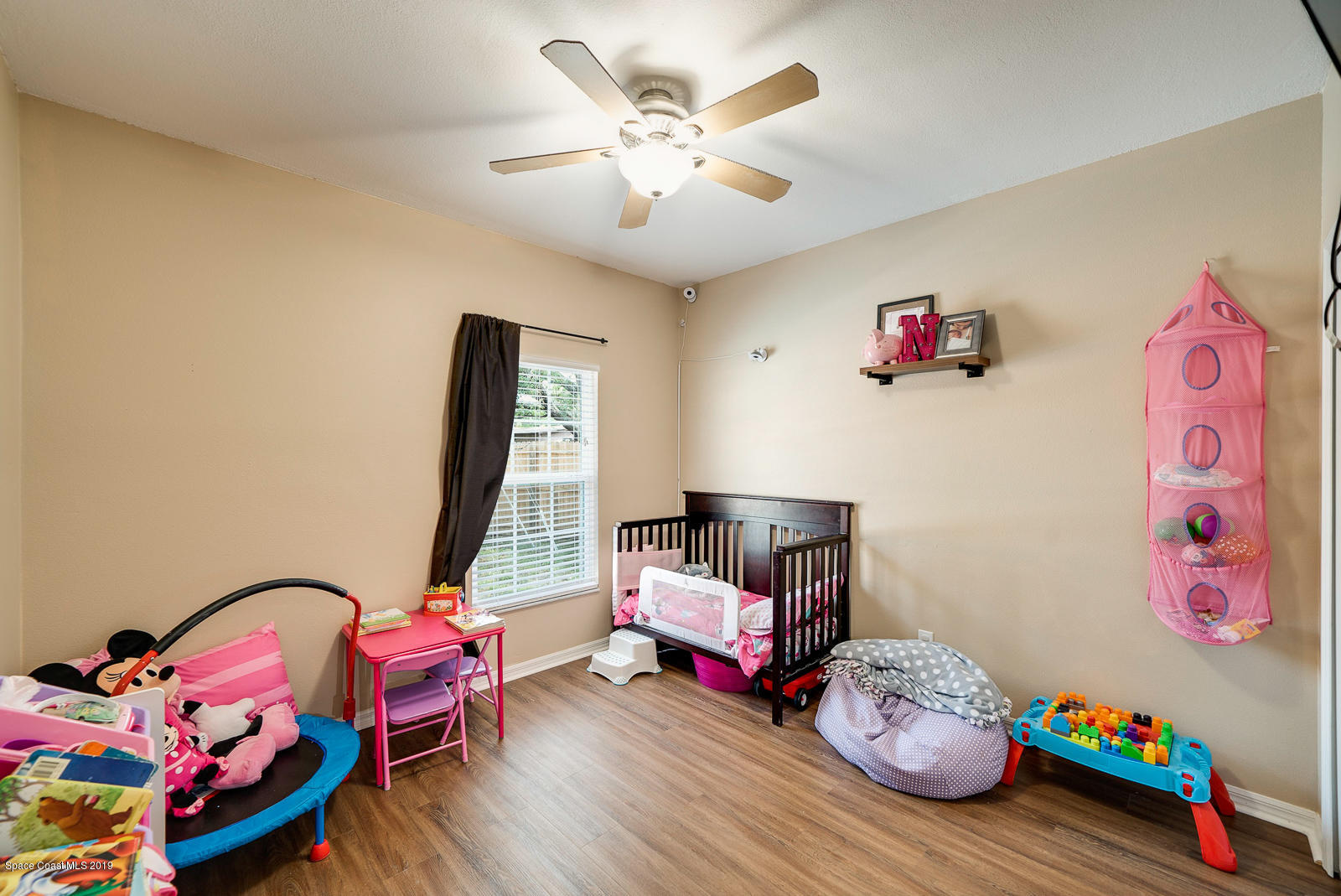 155 Bluff Terrace Melbourne, FL 32901 - Photo 15 of 20 a bedroom with furniture and a chandelier