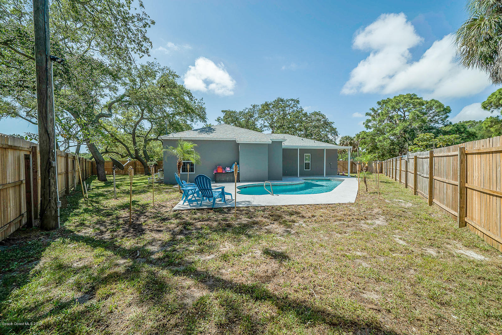 155 Bluff Terrace Melbourne, FL 32901 - Photo 17 of 20 a view of a house with backyard and sitting area