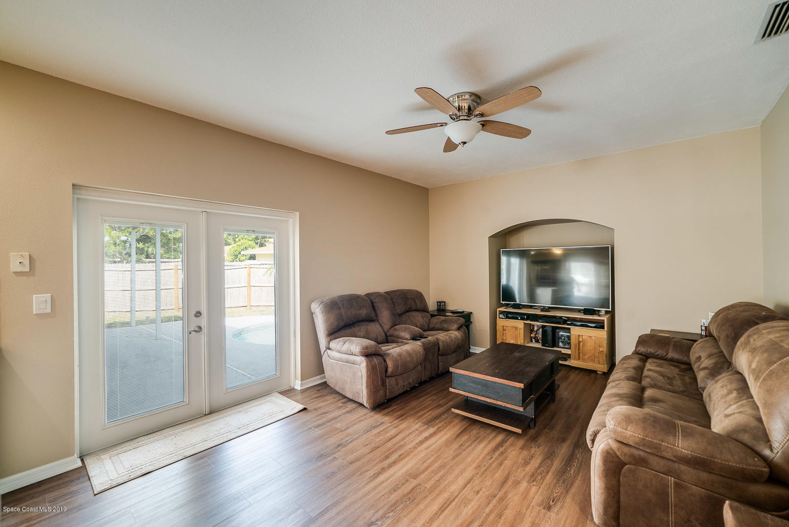 155 Bluff Terrace Melbourne, FL 32901 - Photo 7 of 20 a living room with furniture and a flat screen tv