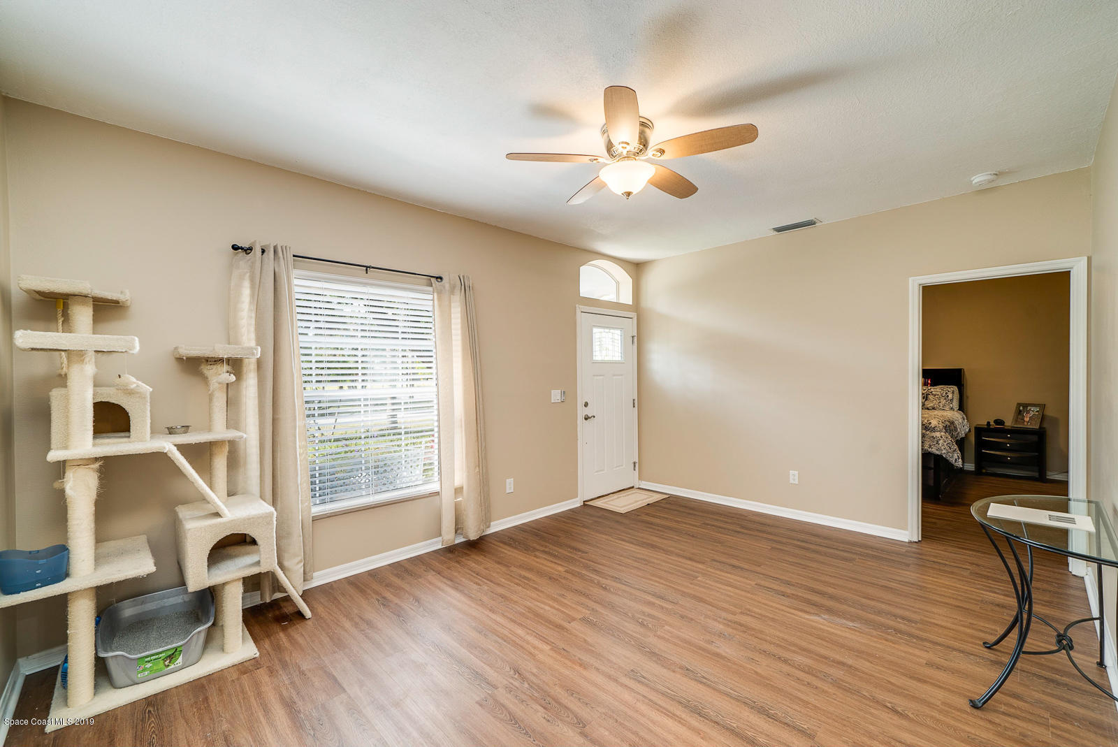 155 Bluff Terrace Melbourne, FL 32901 - Photo 9 of 20 wooden floor in an empty room with a window