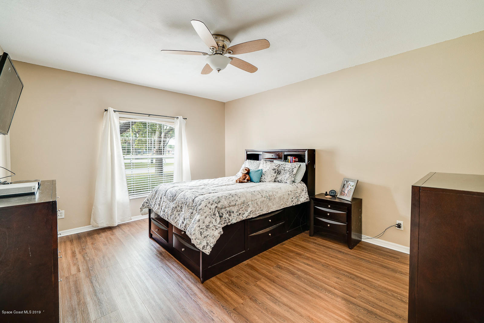 155 Bluff Terrace Melbourne, FL 32901 - Photo 10 of 20 a bedroom with a bed and a window