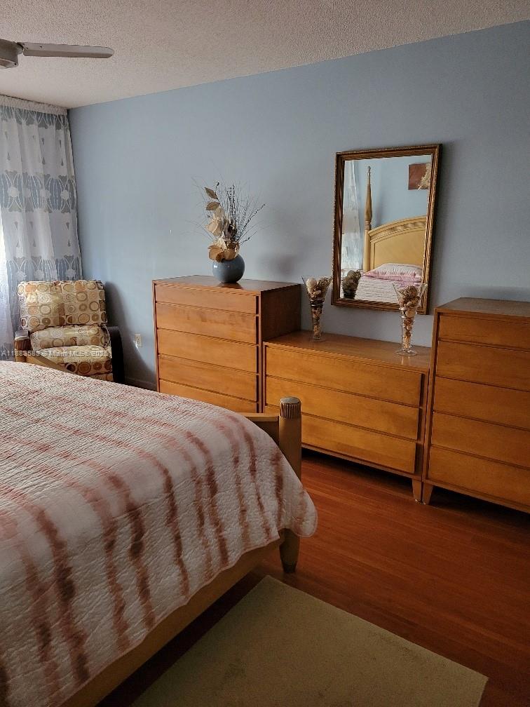 1833 South Ocean Drive, Unit 307 Hallandale Beach, FL 33009 - Photo 13 of 19 a bedroom with two beds and painting on the wall