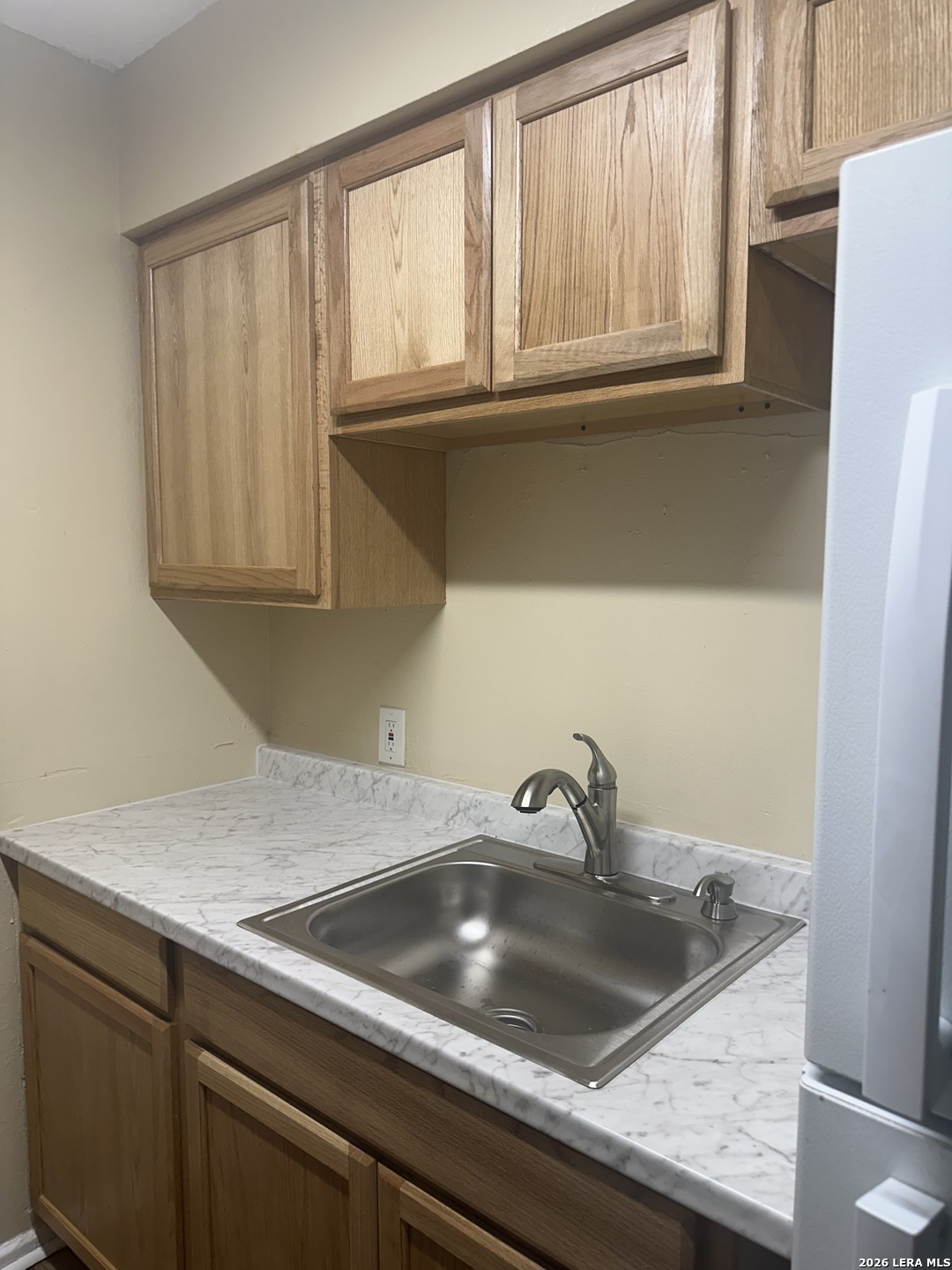 2129 Pat Booker Road, Unit 2 Universal City, TX 78148 - Photo 3 of 8 a kitchen with a sink and cabinets