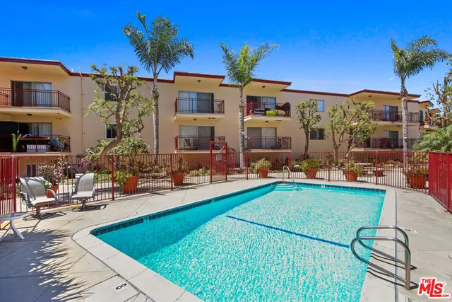 a view of swimming pool with outdoor seating