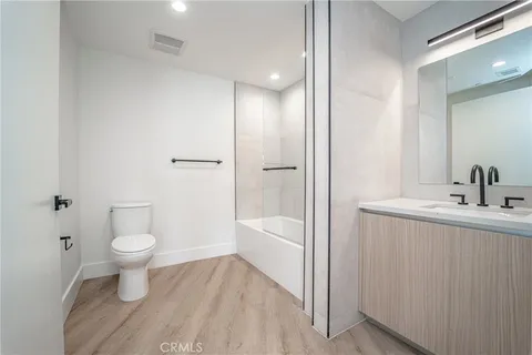 a bathroom with a toilet and a bathtub