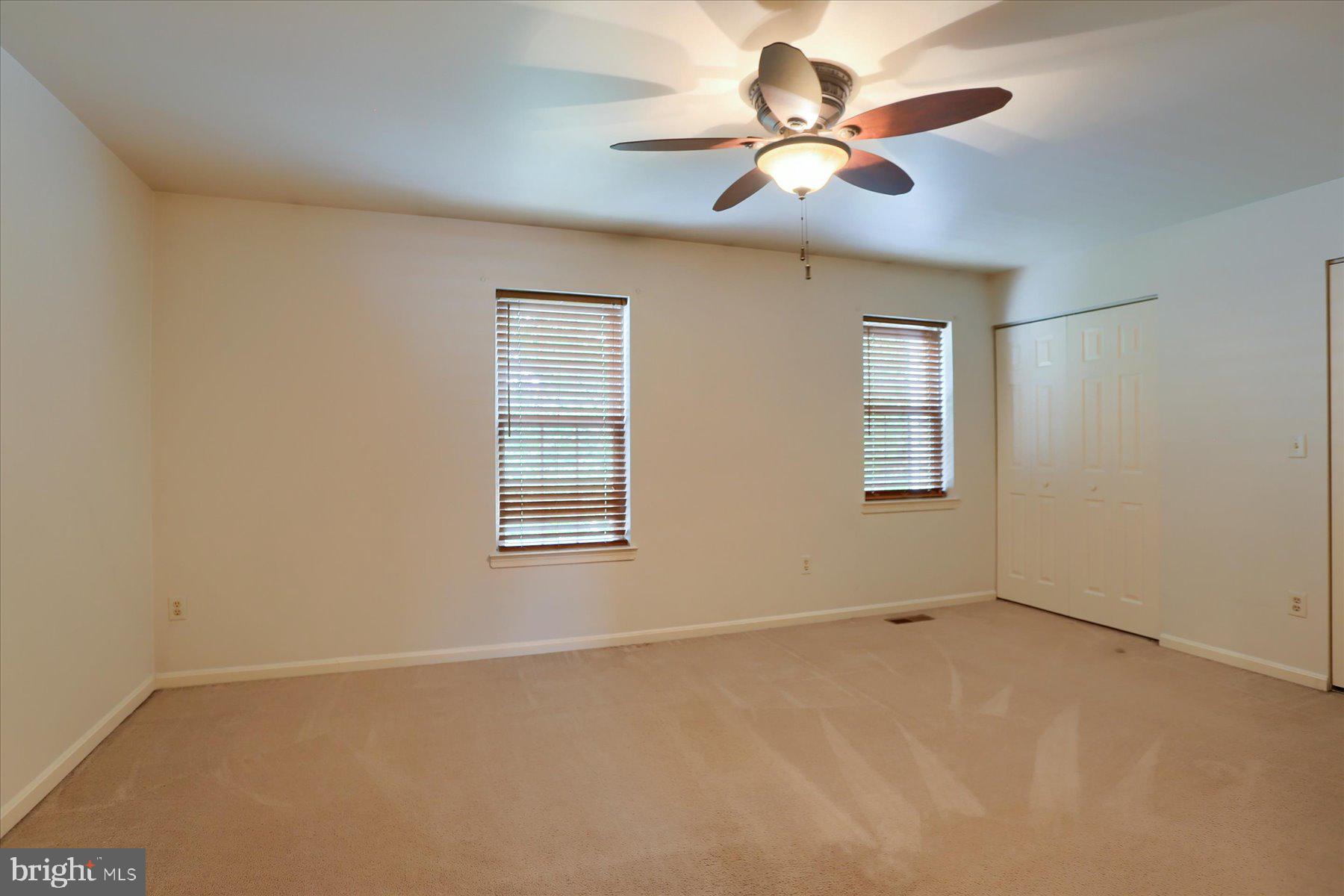 802 Cambridge Court Palmyra, PA 17078 - Photo 13 of 32 an empty room with a window and a ceiling fan