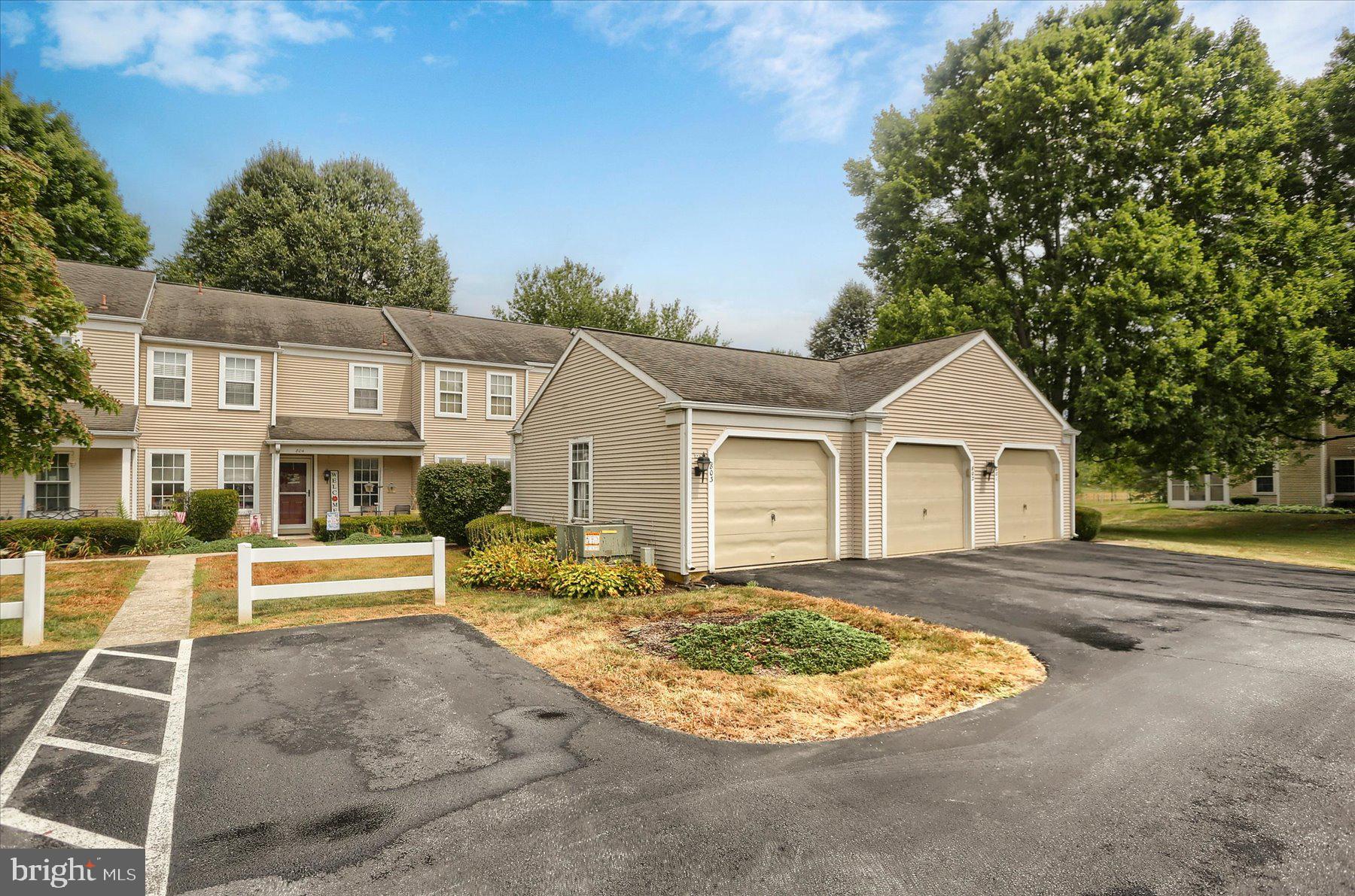 802 Cambridge Court Palmyra, PA 17078 - Photo 6 of 32 a view of a white house next to a yard with large trees